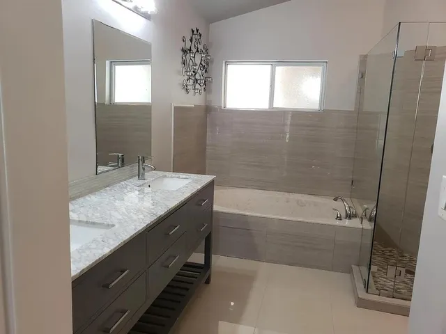 a bedroom with a bed and a chair in it