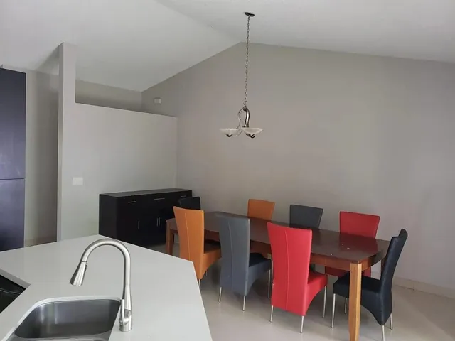a living room with furniture window and flat screen tv
