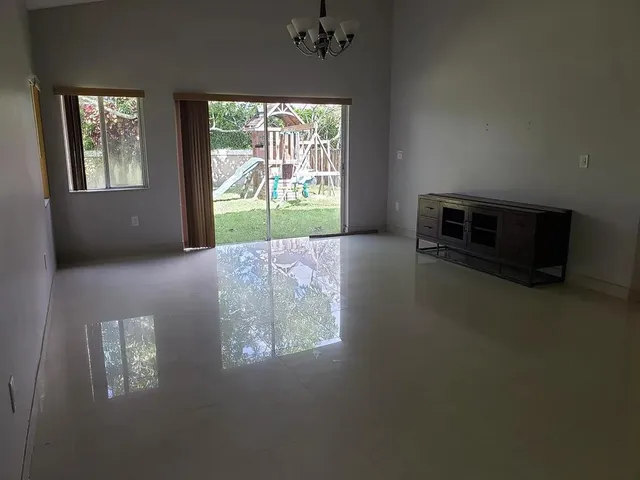 a bathroom with a toilet a sink a vanity and mirror