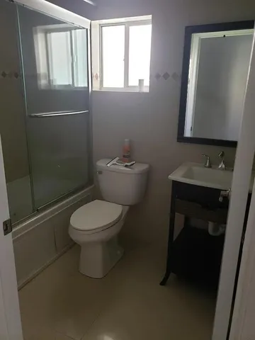a bathroom with a shower and bathtub
