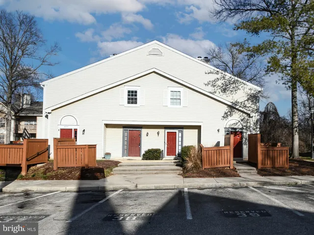 a view of a house with iron fence