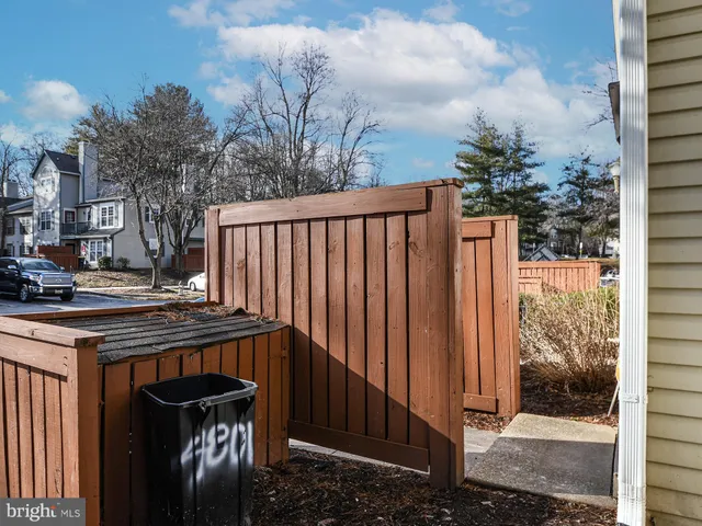 a view of a yard with yellow lighting