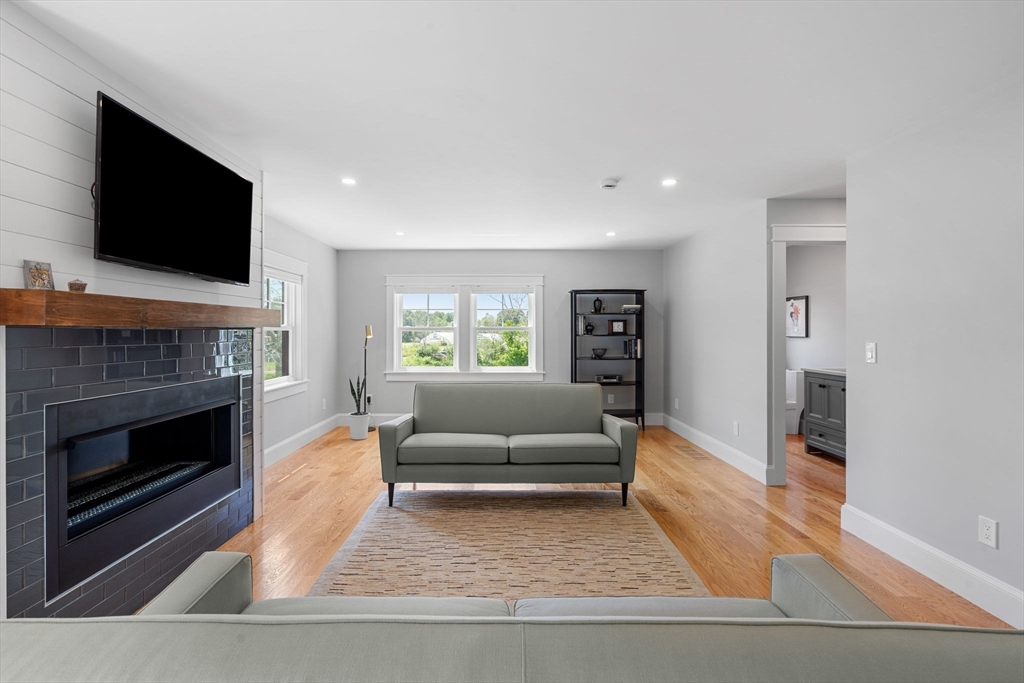 182 High Road Newbury, MA 01951 - Photo 11 of 42 a living room with furniture and a fireplace