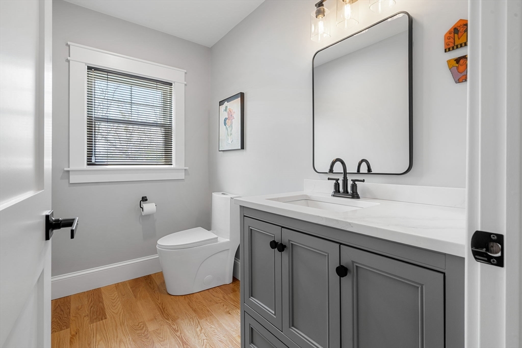 182 High Road Newbury, MA 01951 - Photo 14 of 42 a bathroom with a toilet sink and mirror