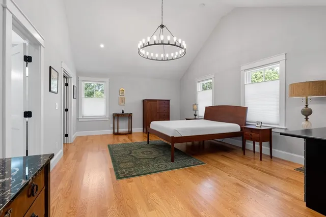 a bedroom with a bed and a table in it