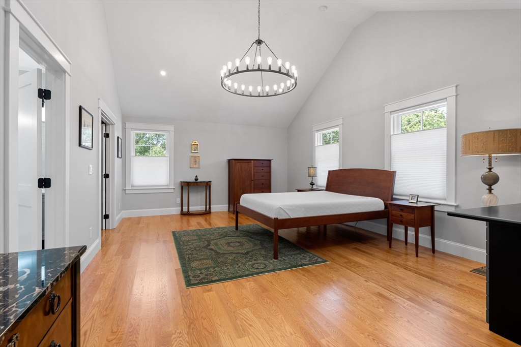 182 High Road Newbury, MA 01951 - Photo 16 of 42 a bedroom with a bed and a table in it