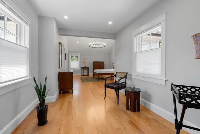 a workspace with furniture window and wooden floor
