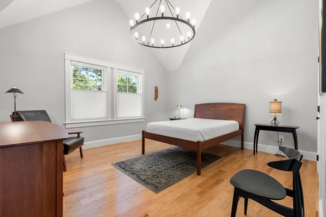 a bedroom with furniture and a window