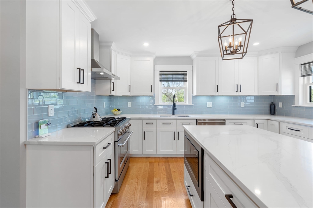 182 High Road Newbury, MA 01951 - Photo 3 of 42 a kitchen with a stove a sink and a refrigerator