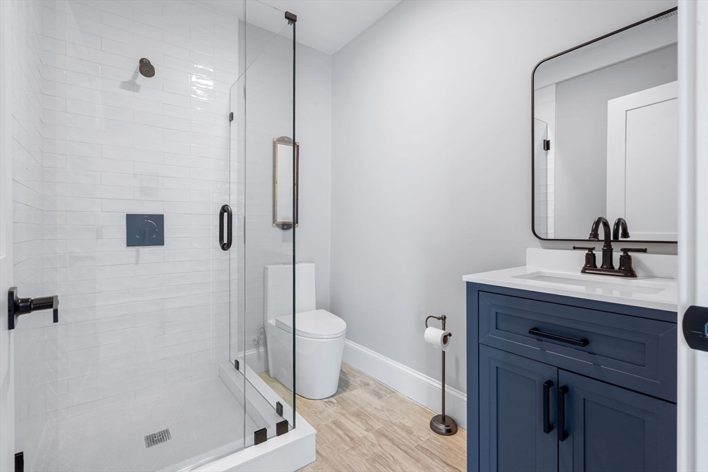 182 High Road Newbury, MA 01951 - Photo 34 of 42 a bathroom with a granite countertop sink a toilet and shower