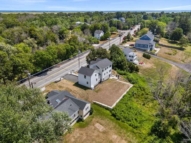 an aerial view of a house with a yard