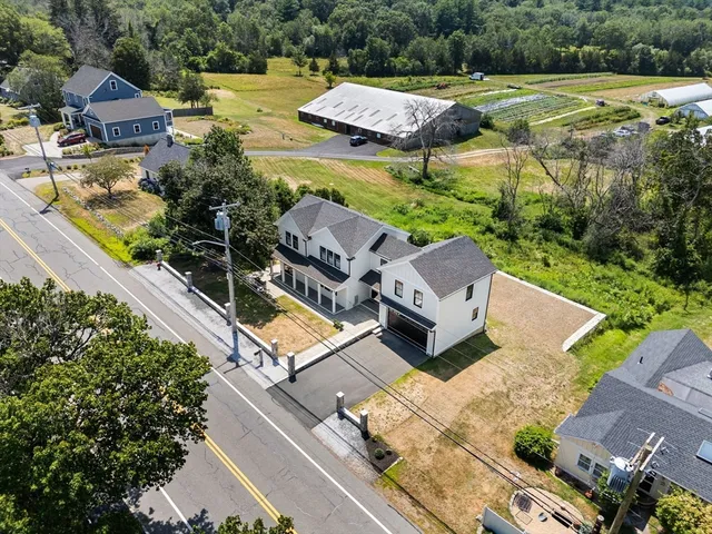 an aerial view of a house with a garden