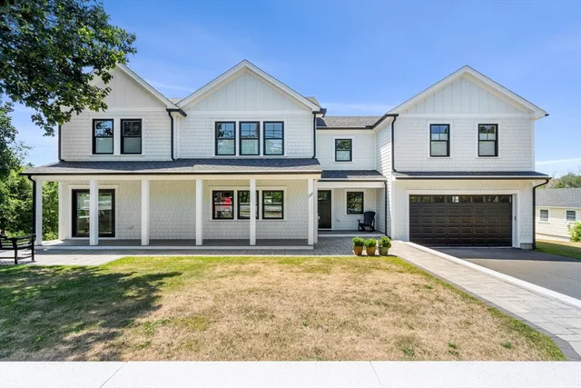 a view of a house with a yard in front of it