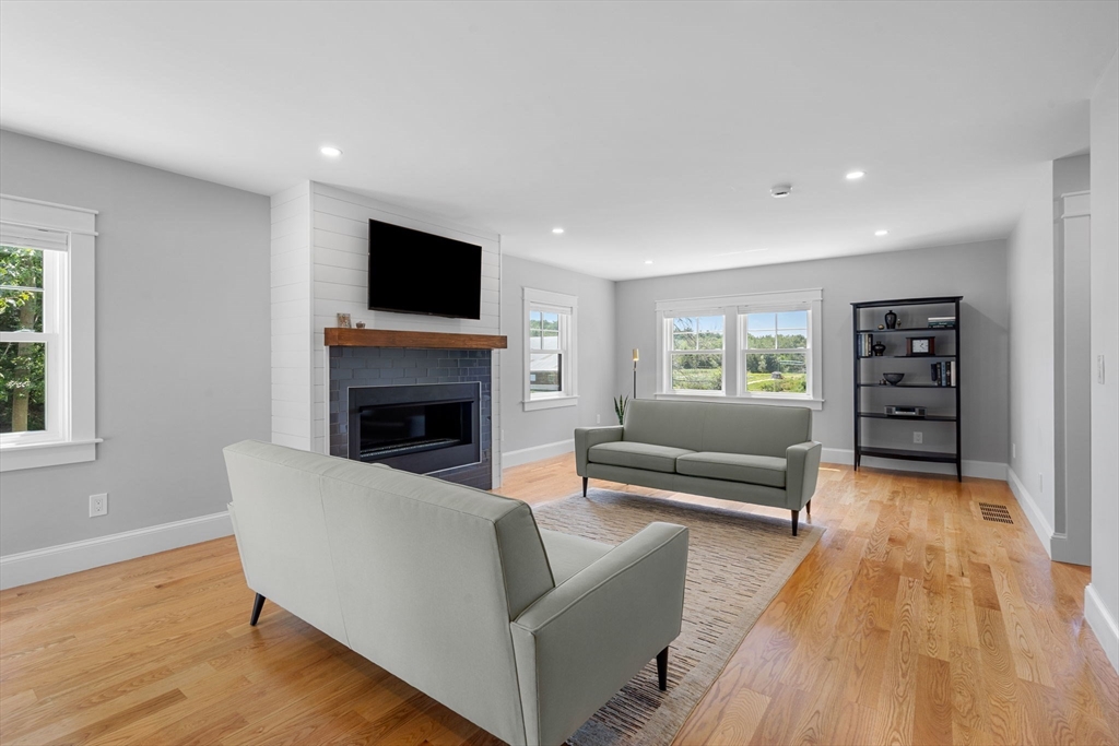 182 High Road Newbury, MA 01951 - Photo 10 of 42 a living room with furniture and a flat screen tv