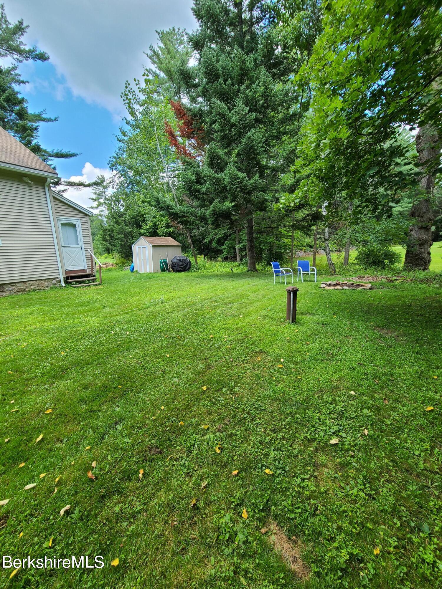 164 Cross Road Clarksburg, MA 01247 - Photo 20 of 22 a green field covered with trees
