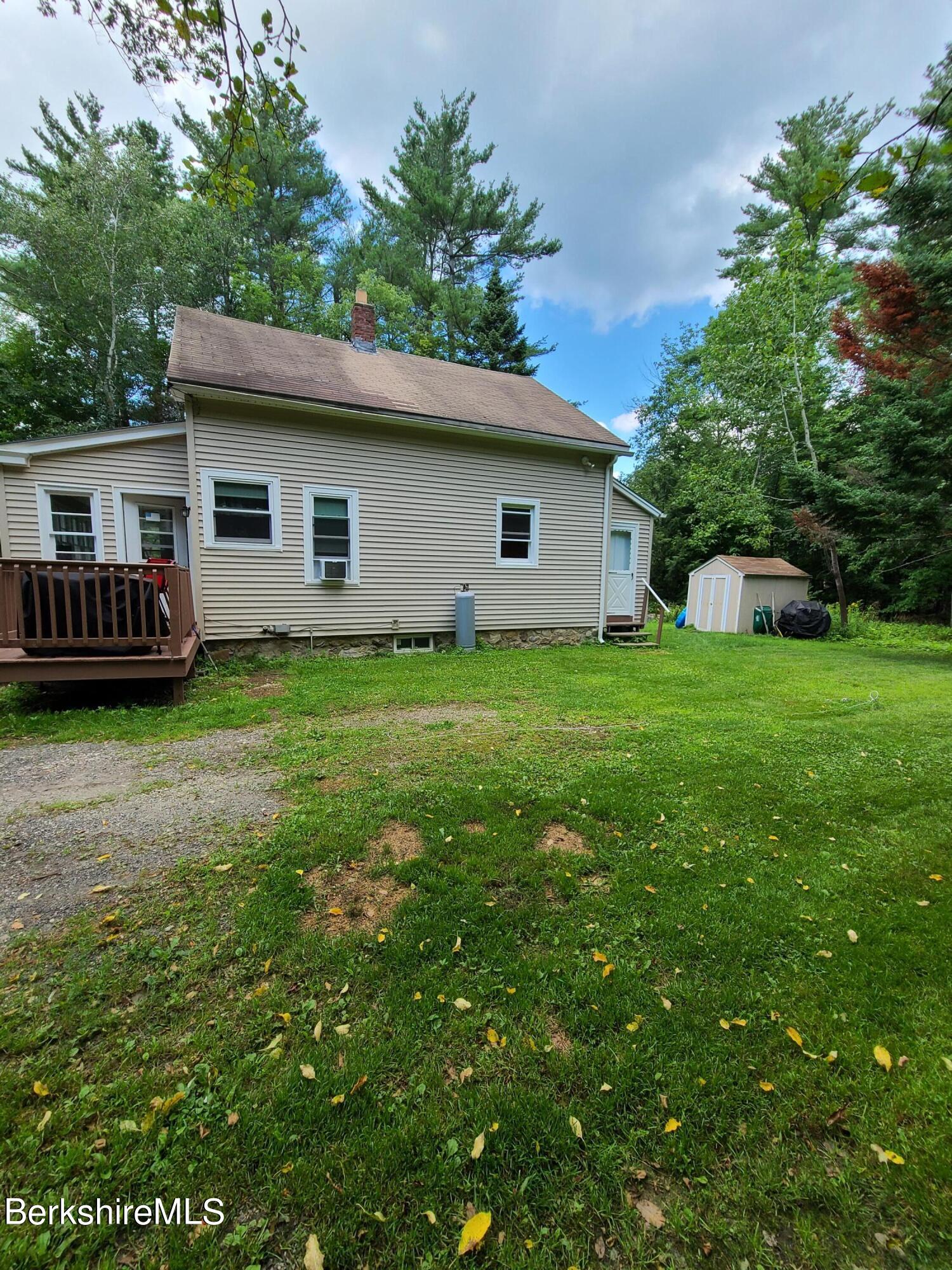 164 Cross Road Clarksburg, MA 01247 - Photo 21 of 22 a front view of a house with a garden