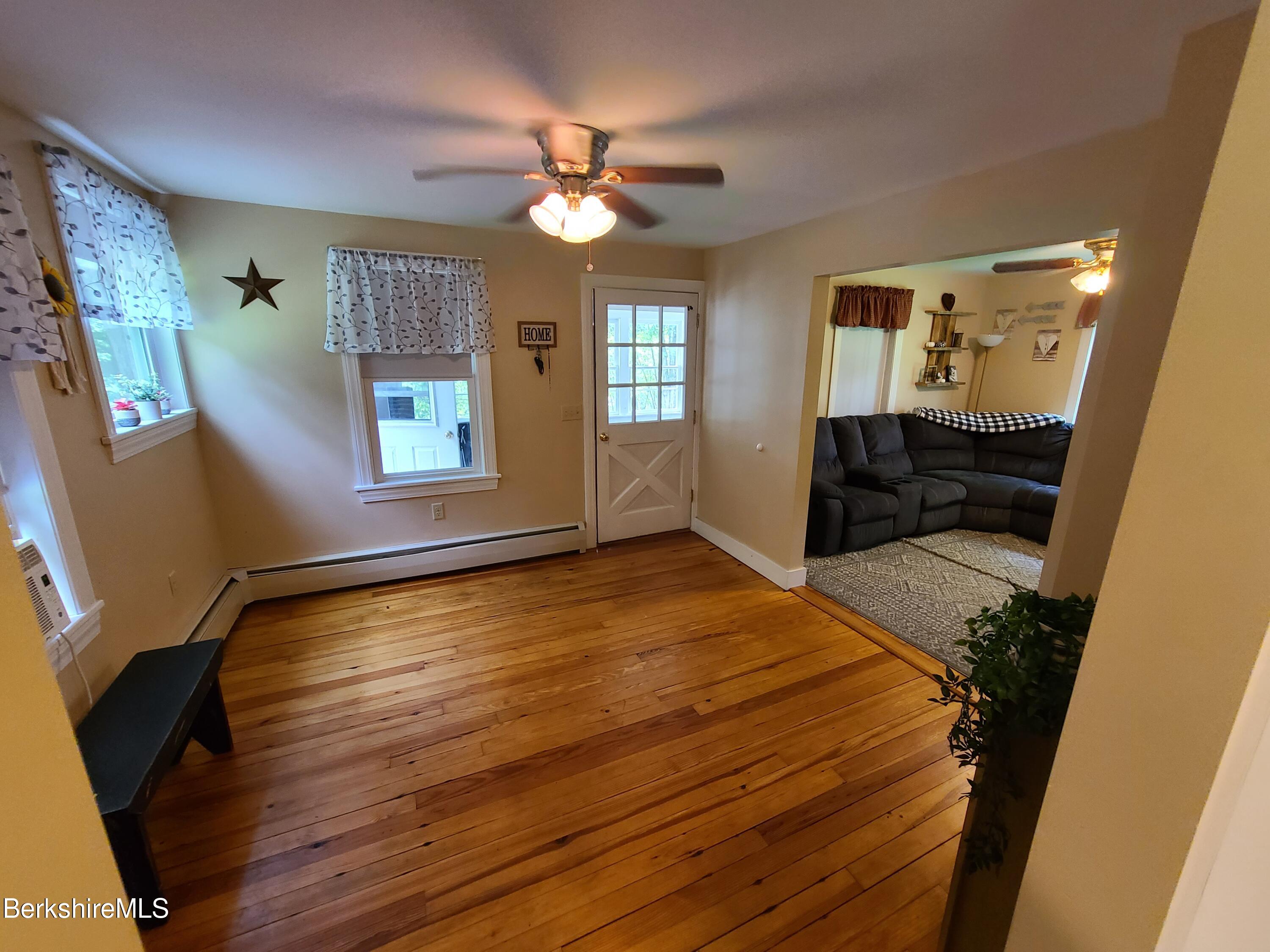 164 Cross Road Clarksburg, MA 01247 - Photo 4 of 22 a view of an empty room with wooden floor and a window