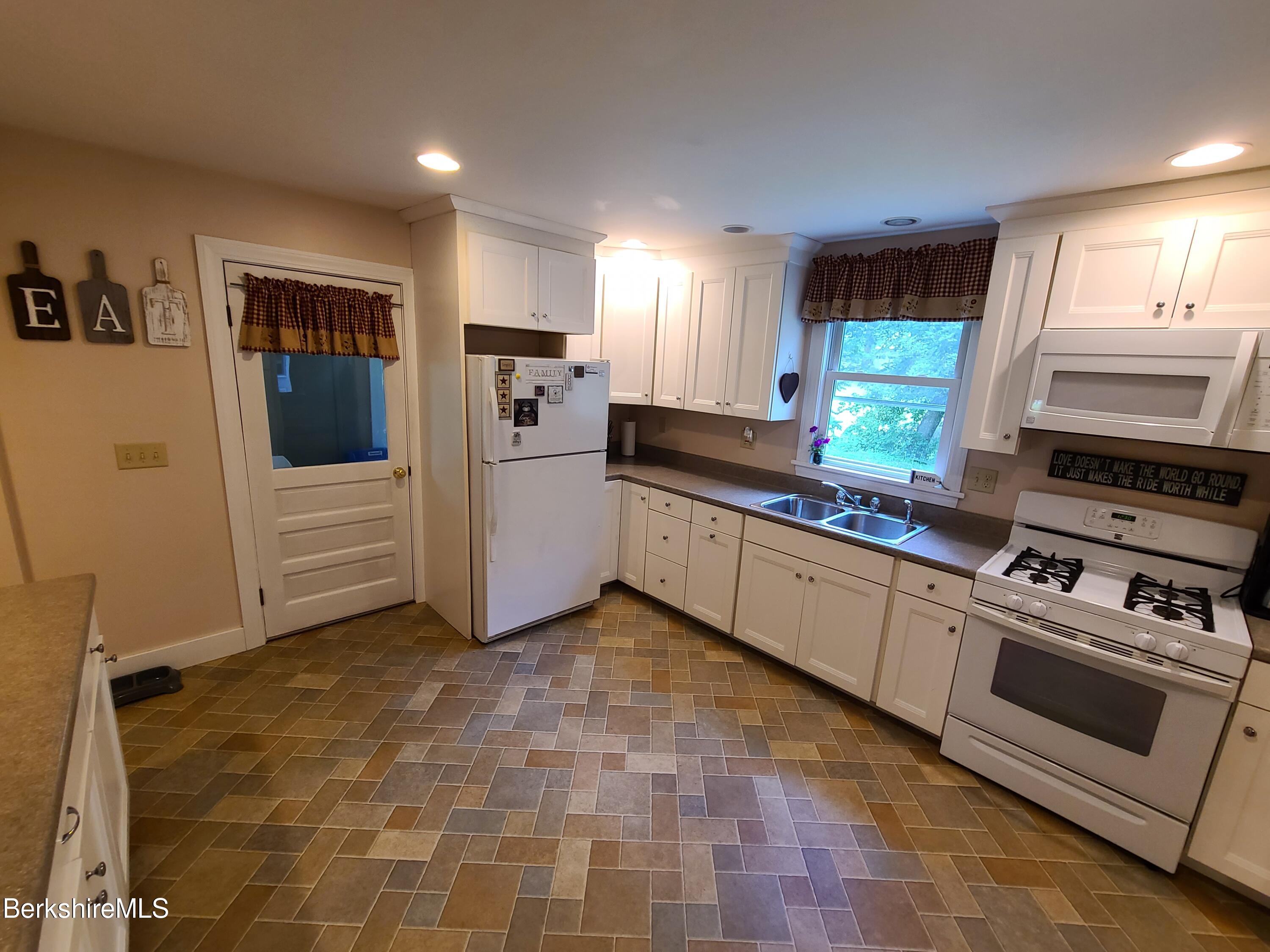 164 Cross Road Clarksburg, MA 01247 - Photo 6 of 22 a kitchen with stainless steel appliances granite countertop a stove a sink and a refrigerator