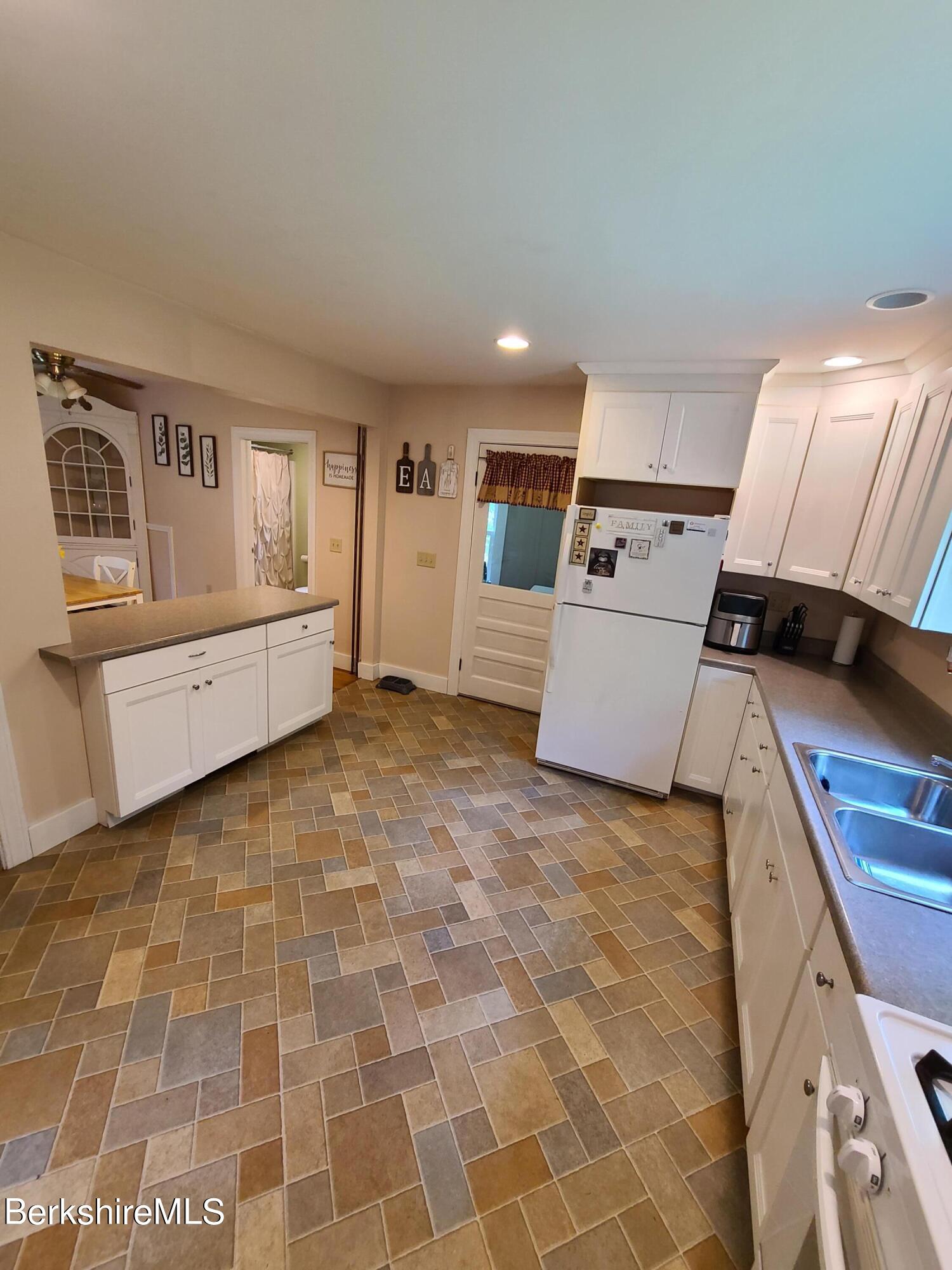 164 Cross Road Clarksburg, MA 01247 - Photo 7 of 22 a living room with a couch and a stove top oven