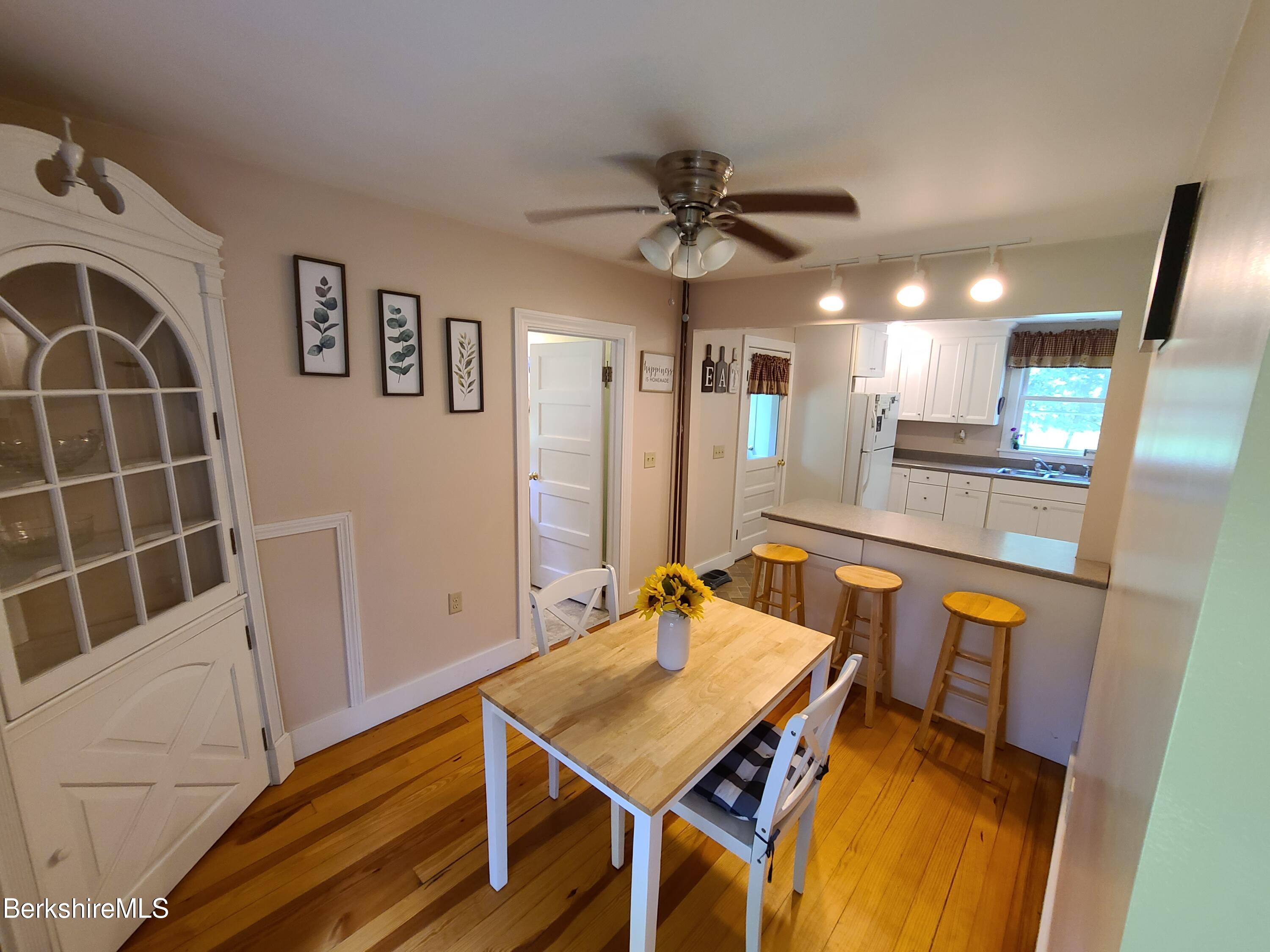164 Cross Road Clarksburg, MA 01247 - Photo 10 of 22 a view of a dining room with furniture and a chandelier