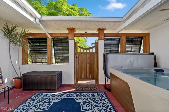 a living room with furniture rug and a table