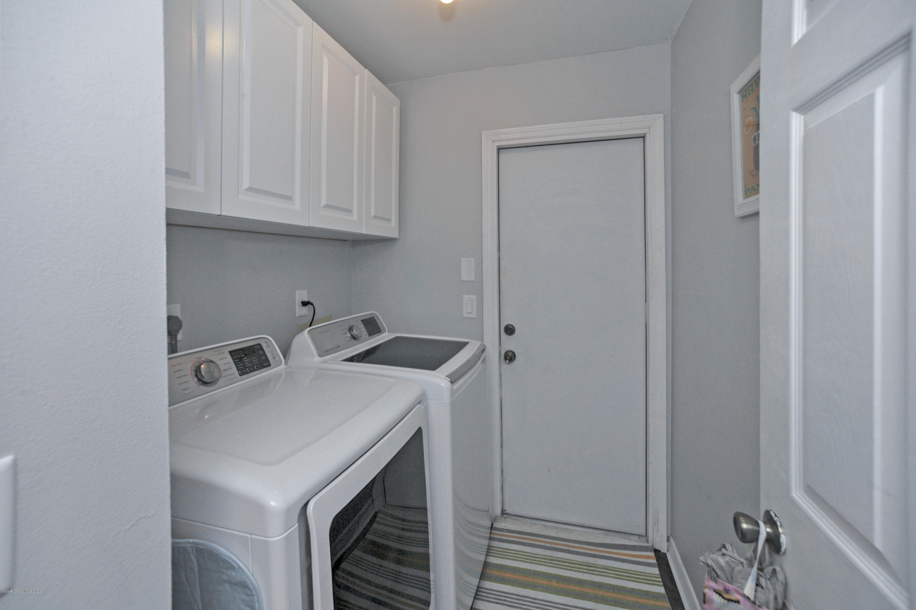 877 Walpole Road Southwest Palm Bay, FL 32908 - Photo 15 of 27 a utility room with sink dryer and washer