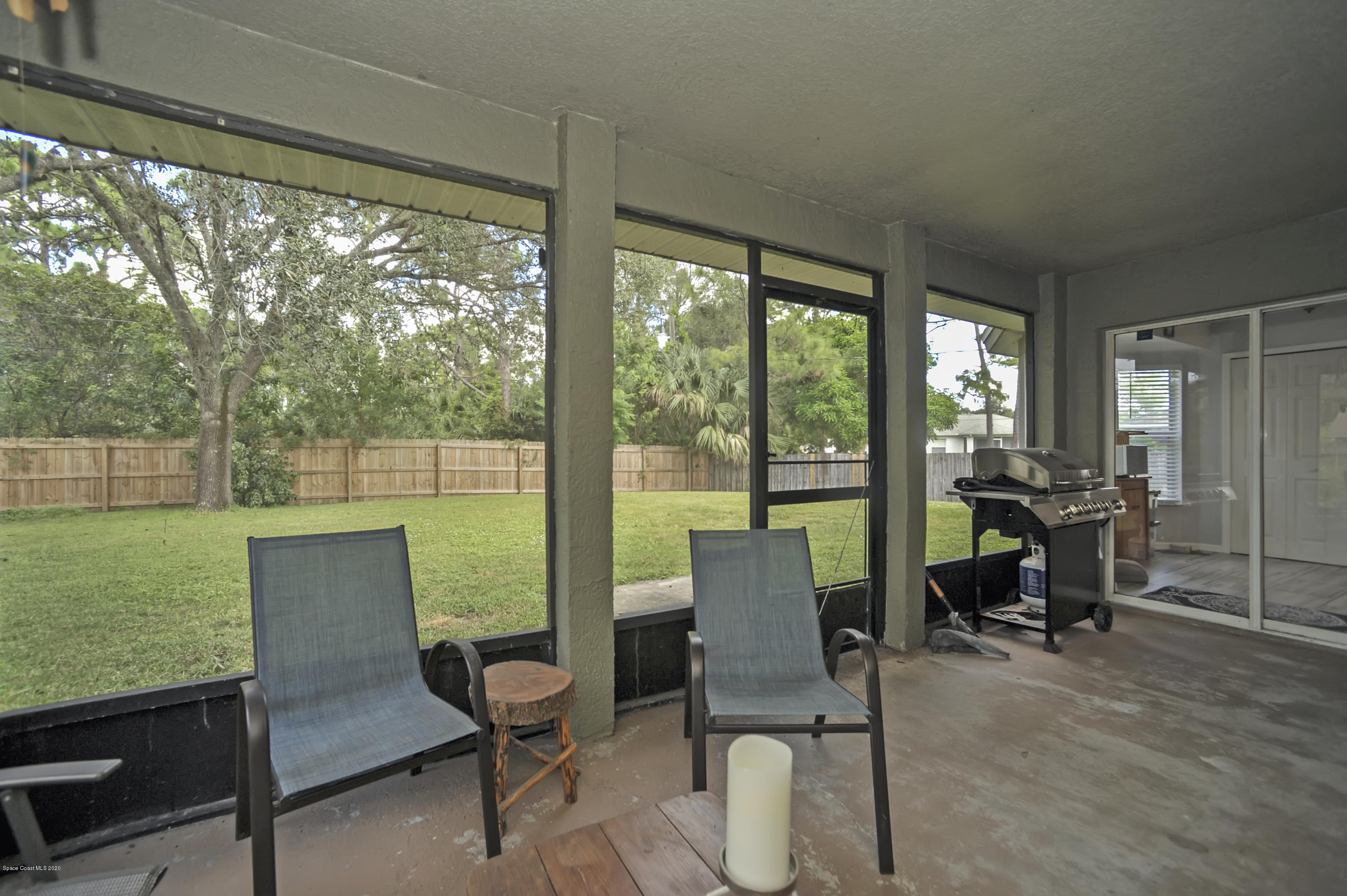 877 Walpole Road Southwest Palm Bay, FL 32908 - Photo 25 of 27 a view of a dining room with furniture window and outside view