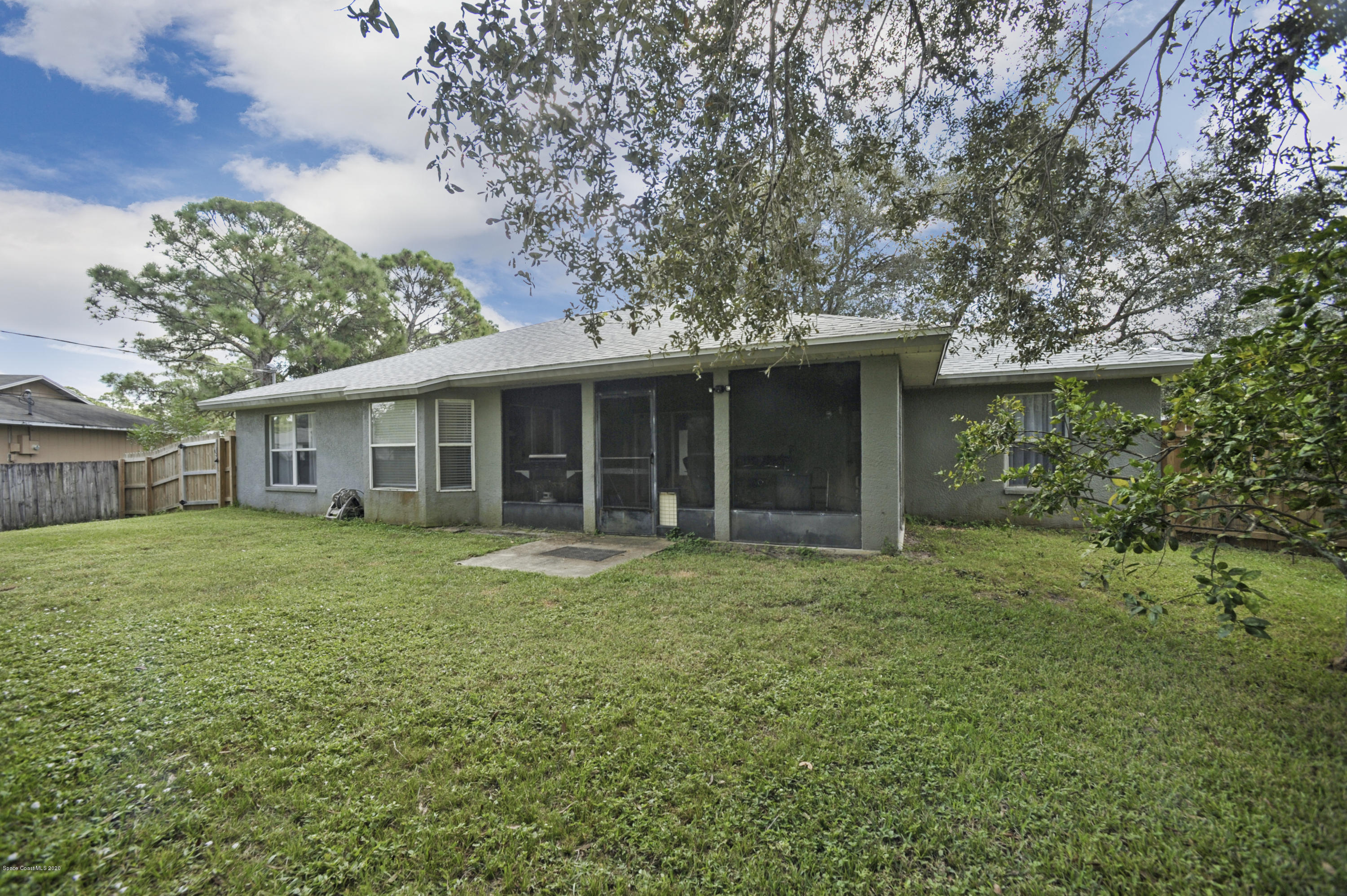 877 Walpole Road Southwest Palm Bay, FL 32908 - Photo 26 of 27 a front view of a house with a garden