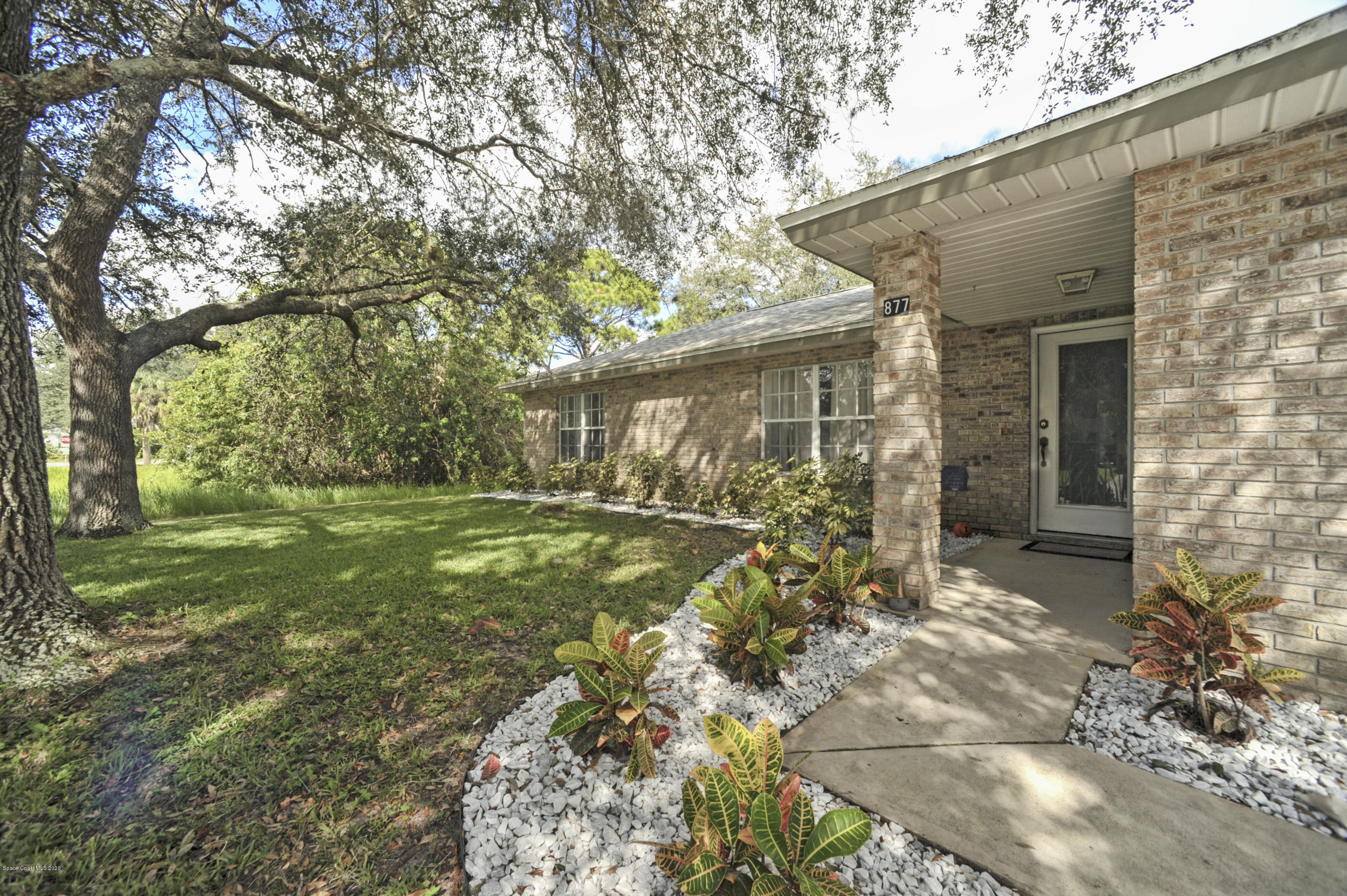 877 Walpole Road Southwest Palm Bay, FL 32908 - Photo 4 of 27 a view of a house with a yard