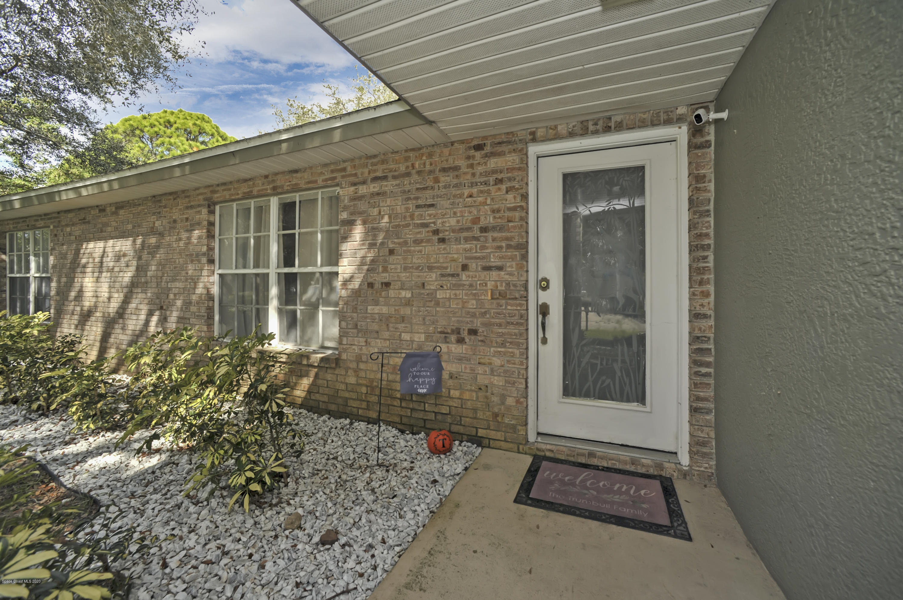 877 Walpole Road Southwest Palm Bay, FL 32908 - Photo 5 of 27 a front view of a house