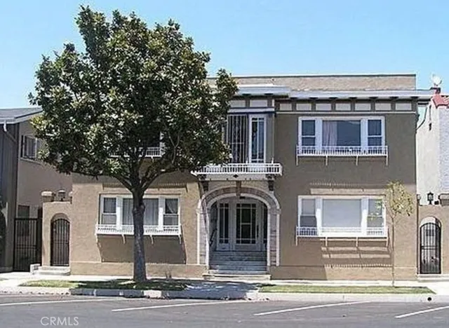 a view of a car park front of a house