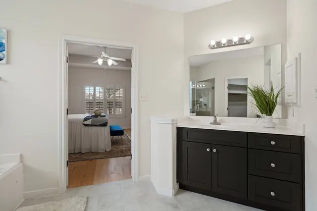 a bathroom with a sink a vanity and mirror
