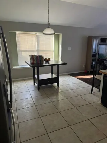 a kitchen with a sink a stove a refrigerator and cabinets