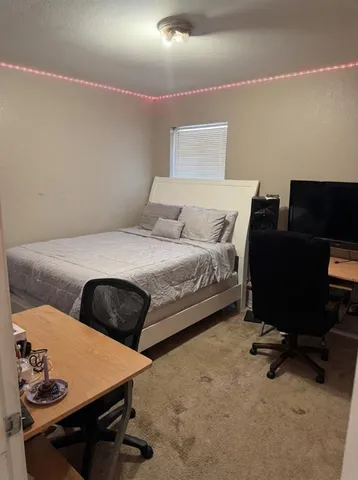 a view of a livingroom with furniture and window