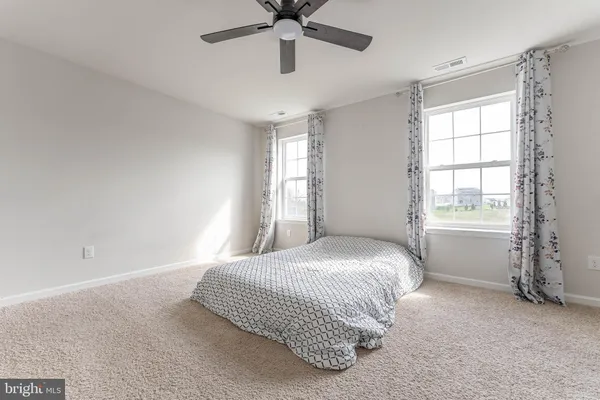 a living room with furniture and windows