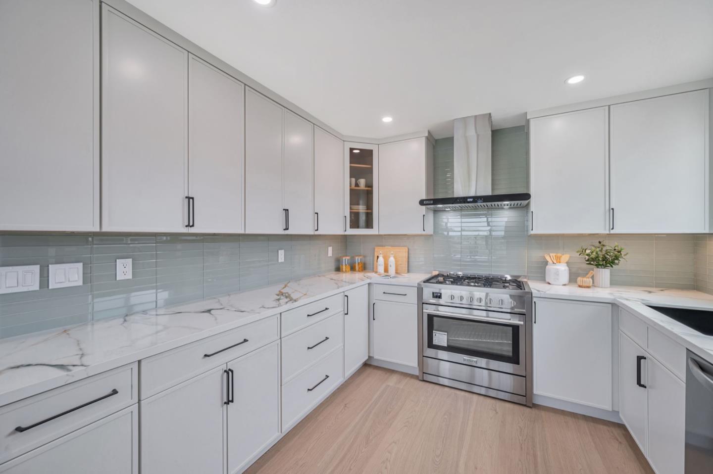 443 Andover Drive Pacifica, CA 94044 - Photo 14 of 56 a kitchen with cabinets appliances a sink and a counter space