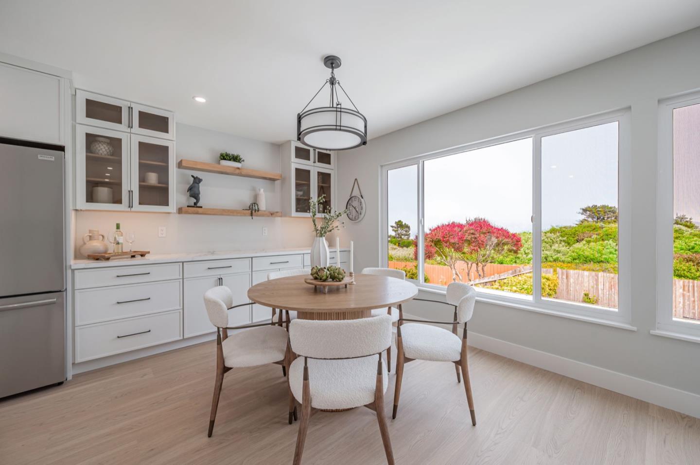 443 Andover Drive Pacifica, CA 94044 - Photo 19 of 56 a dining room with furniture a chandelier and window