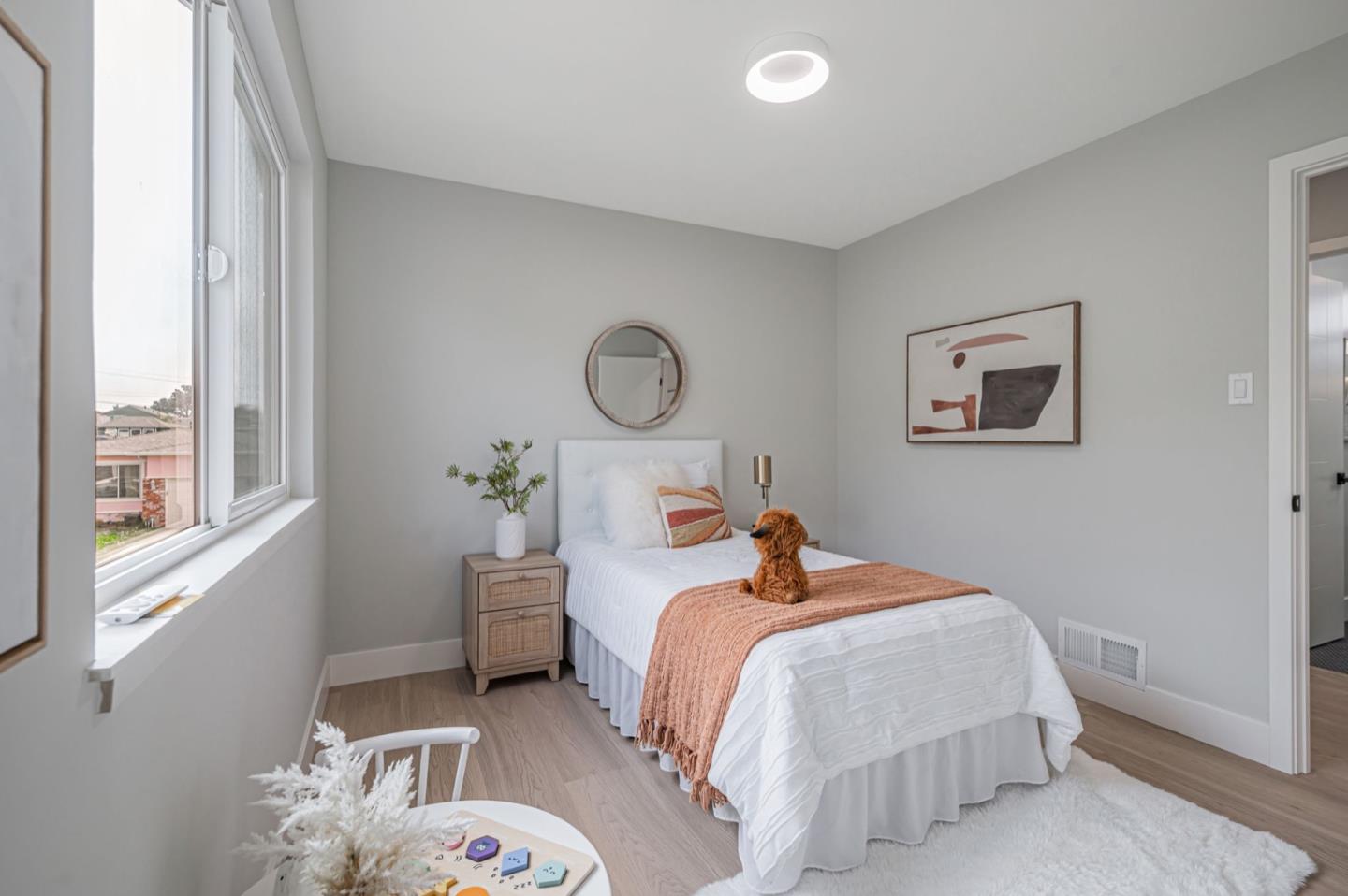 443 Andover Drive Pacifica, CA 94044 - Photo 22 of 56 a bedroom with a bed and a window