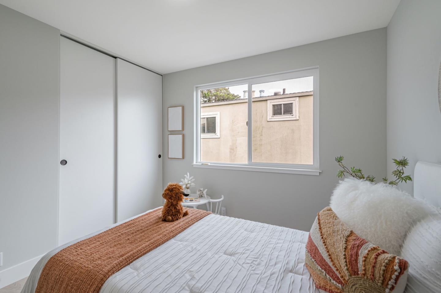 443 Andover Drive Pacifica, CA 94044 - Photo 23 of 56 a bedroom with a bed and wooden floor