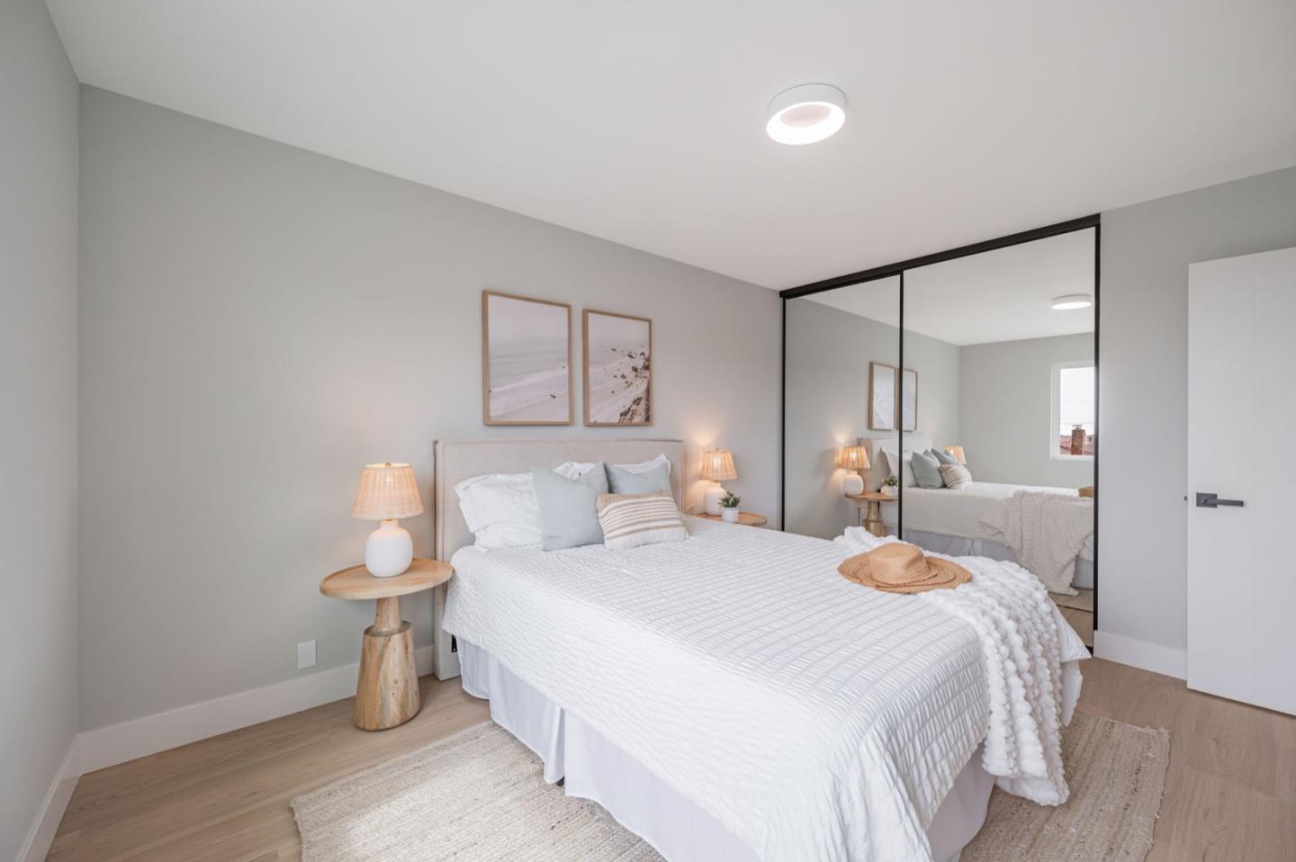 443 Andover Drive Pacifica, CA 94044 - Photo 26 of 56 a bedroom with a bed and a mirror