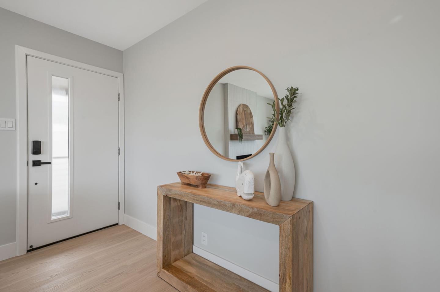 443 Andover Drive Pacifica, CA 94044 - Photo 3 of 56 a room with a mirror and a wooden floor