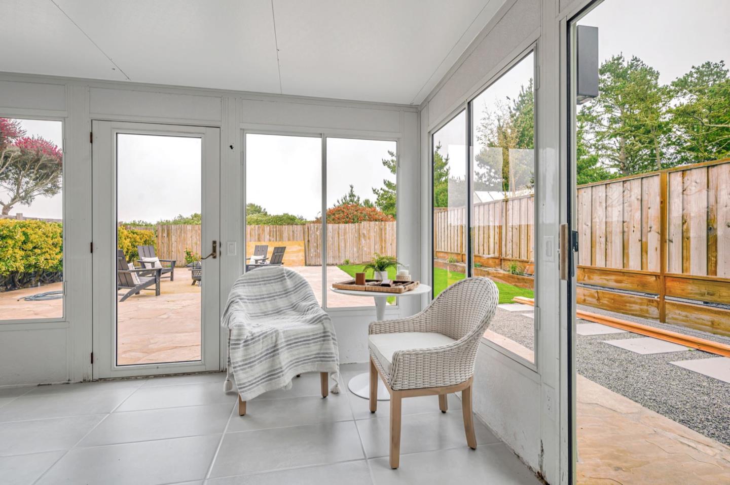 443 Andover Drive Pacifica, CA 94044 - Photo 39 of 56 a living room with furniture and floor to ceiling windows