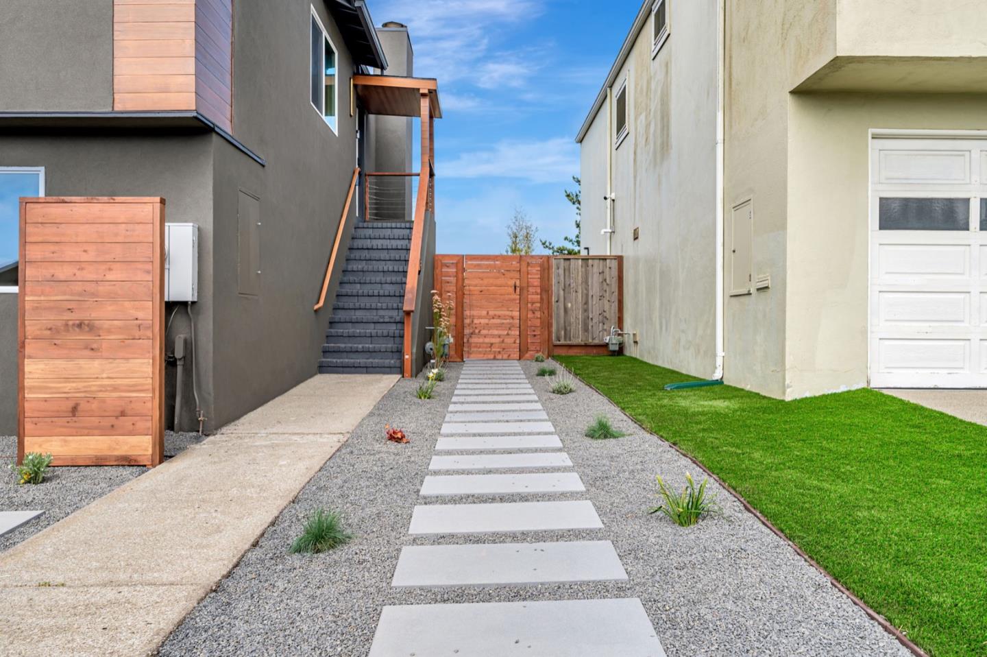 443 Andover Drive Pacifica, CA 94044 - Photo 46 of 56 a view of a pathway with a white house
