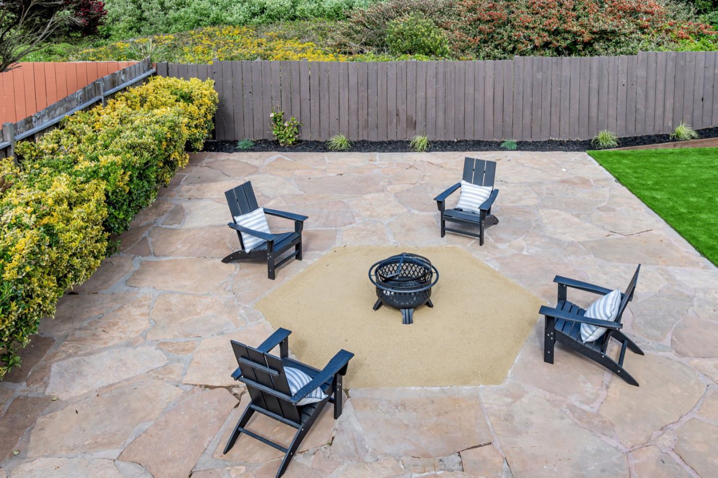 443 Andover Drive Pacifica, CA 94044 - Photo 51 of 56 a view of a backyard with chairs