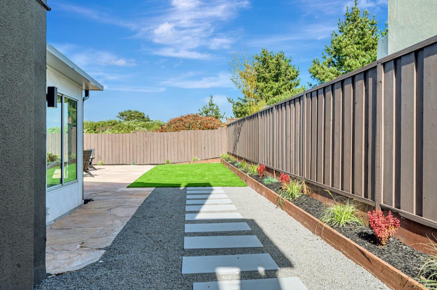 443 Andover Drive Pacifica, CA 94044 - Photo 53 of 56 a view of a pathway with a garden