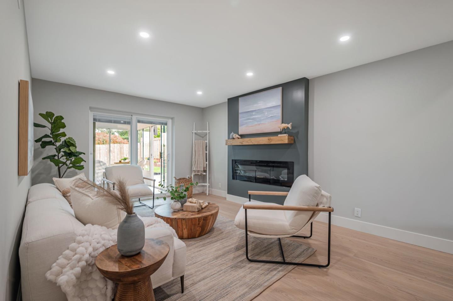 443 Andover Drive Pacifica, CA 94044 - Photo 10 of 56 a living room with furniture a window and a fireplace
