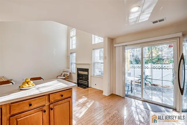 a view of a kitchen with furniture and a fireplace