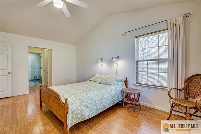a bedroom with a bed chair and a window