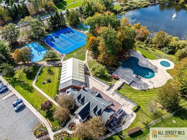 an aerial view of residential house with outdoor space and swimming pool