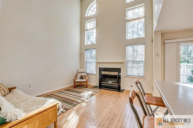 a bedroom with a bed and a fireplace